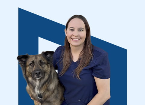 Penn Foster Vet Tech student, Kelsy, with her dog, in front of blue background.