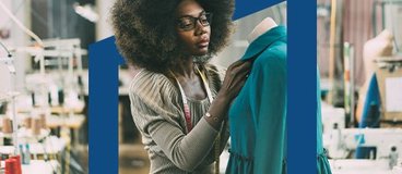 Woman designing dress using dress form.