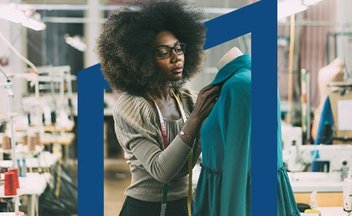Woman designing dress using dress form.
