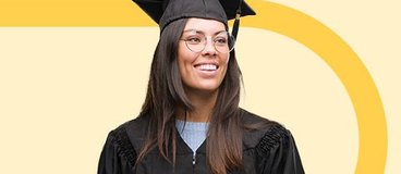 Woman in black graduation cap and gown smiling.
