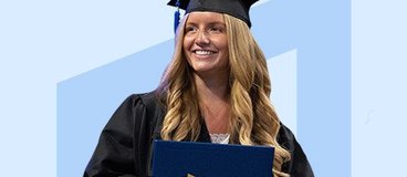 woman in cap and gown holding diploma.