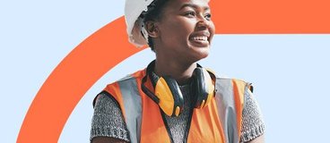 Woman in safety vest and hard hat.