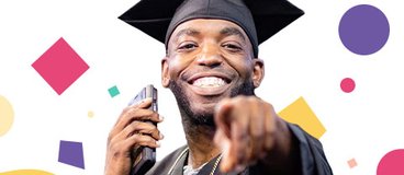 Penn Foster Graduate pointing at the camera and smiling during Graduation 2024.