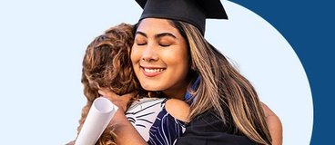 Woman in graduation cap and gown hugging daughter.