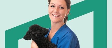 a perfect black puppy and a vet worker.