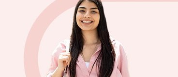 girl in pink shirt on pink background.