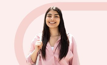 girl in pink shirt on pink background.