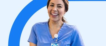 Woman in blue scrubs taking notes.