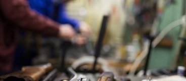 A close up image of a gun in pieces