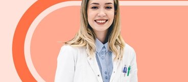 pharmacy technician in white coat on orange background.