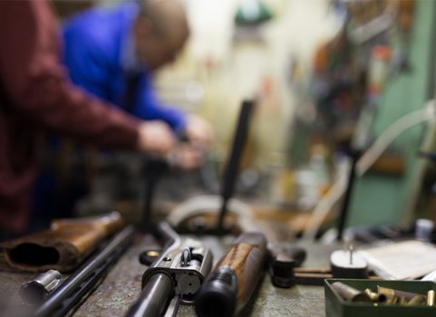 A close up image of a gun in pieces