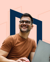 A man with medium brown skintone and dark hair, holding a laptop
