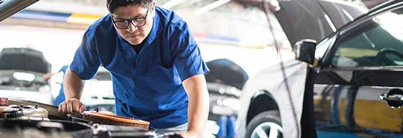 auto mechanic working on a car.