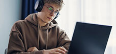 student studying on laptop.