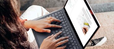 woman typing on a computer.