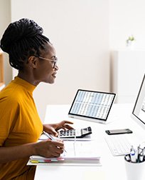 accountant working on desktop computer.