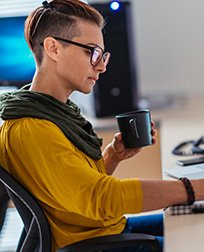 accountant taking notes at desk.