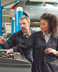 automotive technician working using a computer.