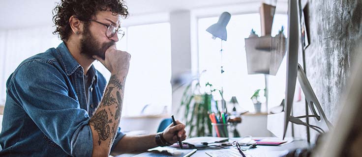computer graphic artist working on computer.