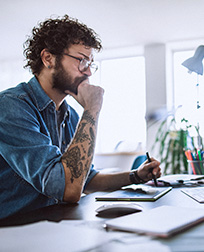 computer graphic artist working on computer.
