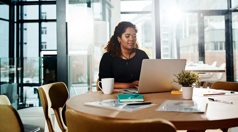 IT professional working on laptop.