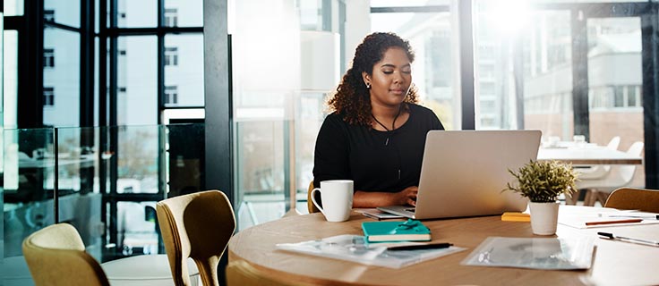 IT professional working on laptop.