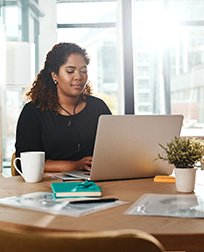 IT professional working on laptop.