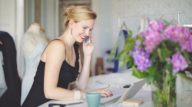 event planner working on laptop.