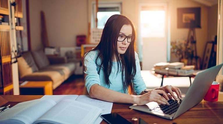 student studying on laptop.