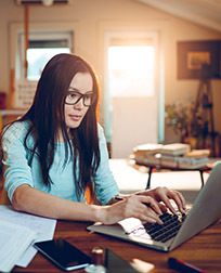 student studying on laptop.