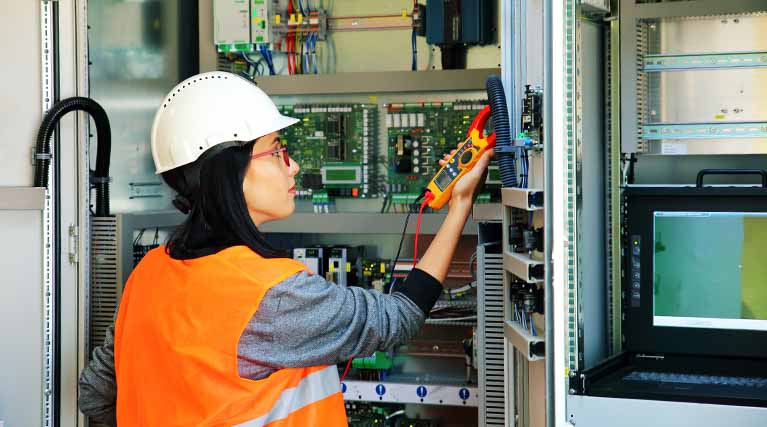 industrial electrician troubleshooting electrical system.