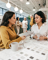 interior designer talks to client in a showroom.