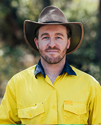 wildlife and forestry professional standing outside.